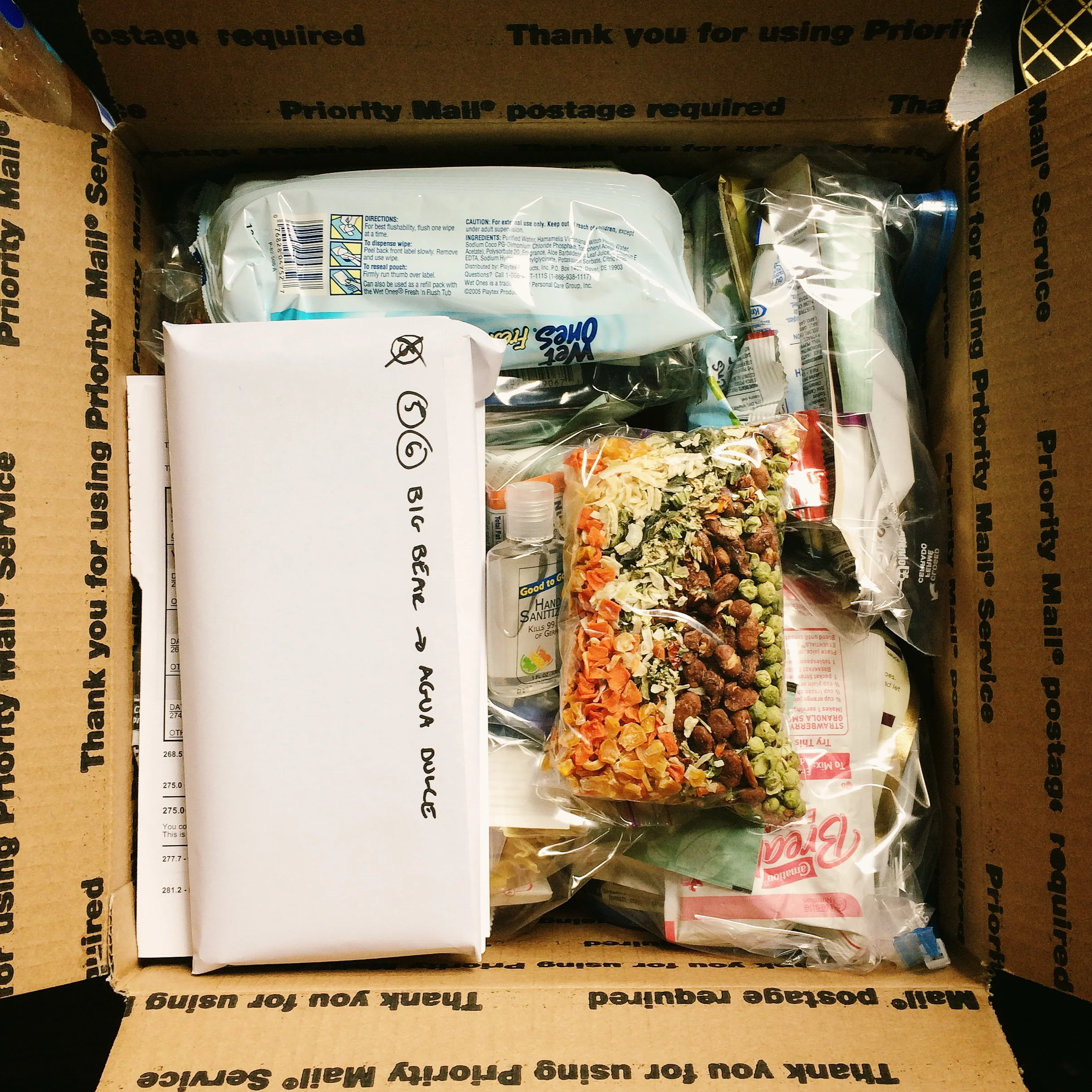 Maps and food fill the boxes. Also gotta send an ice axe and a bug net for the sierras. 