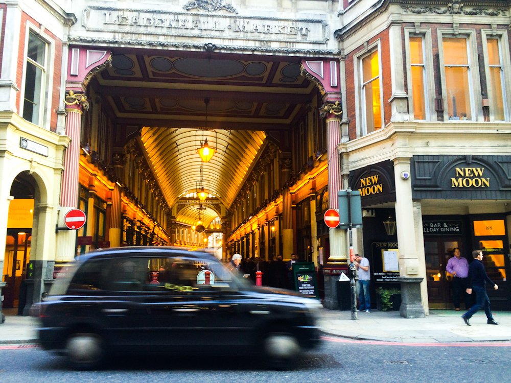 Iconic taxi speeds by in London — England