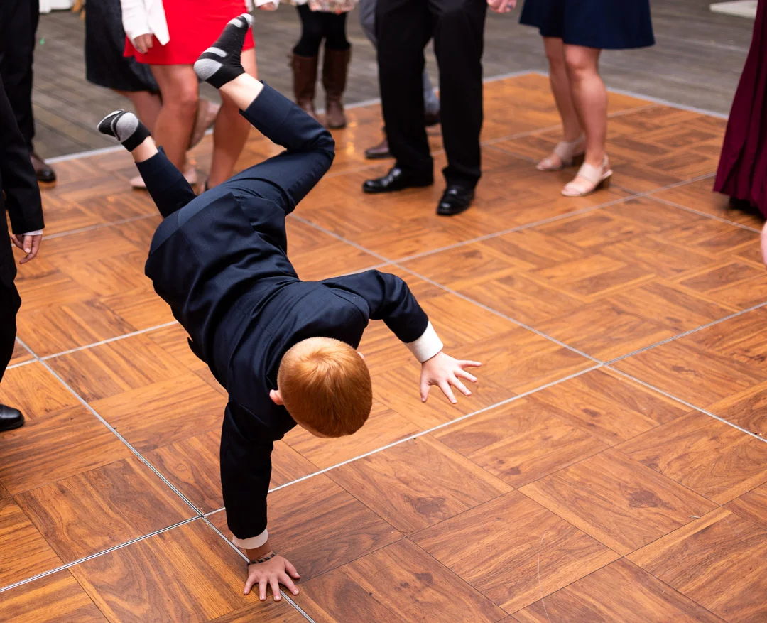 kid break dancing at wedding reception