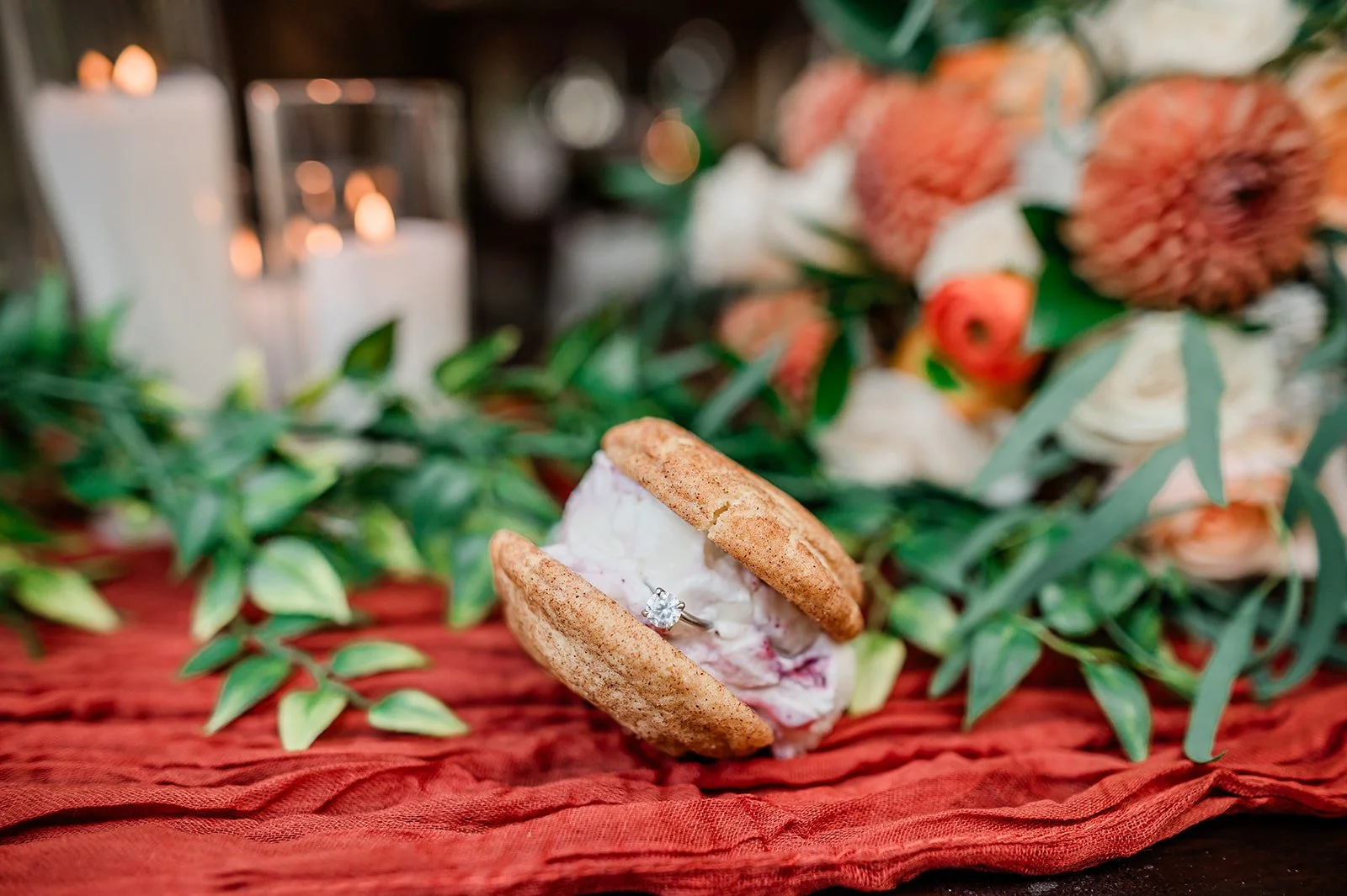 Ice cream sandwich resting on a terracotta table runner with orange blooms at Woodland Meadow Farms