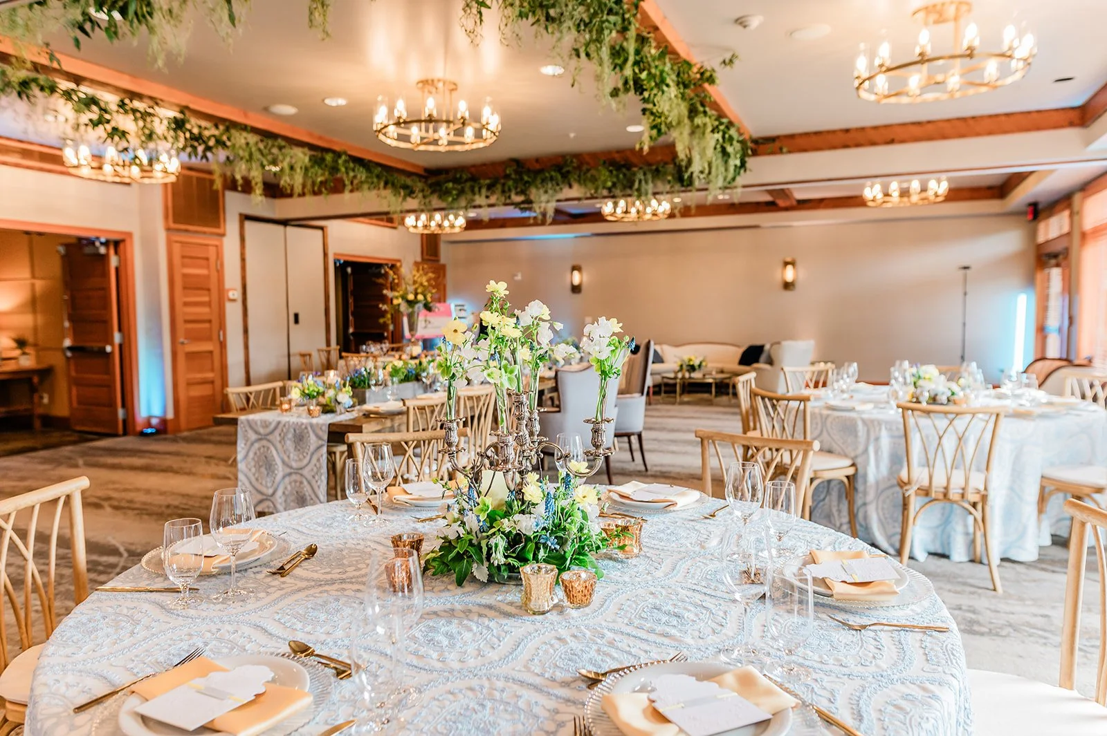 Sammamish Ballroom reception with floral centerpieces at Willows Lodge, Woodinville WA