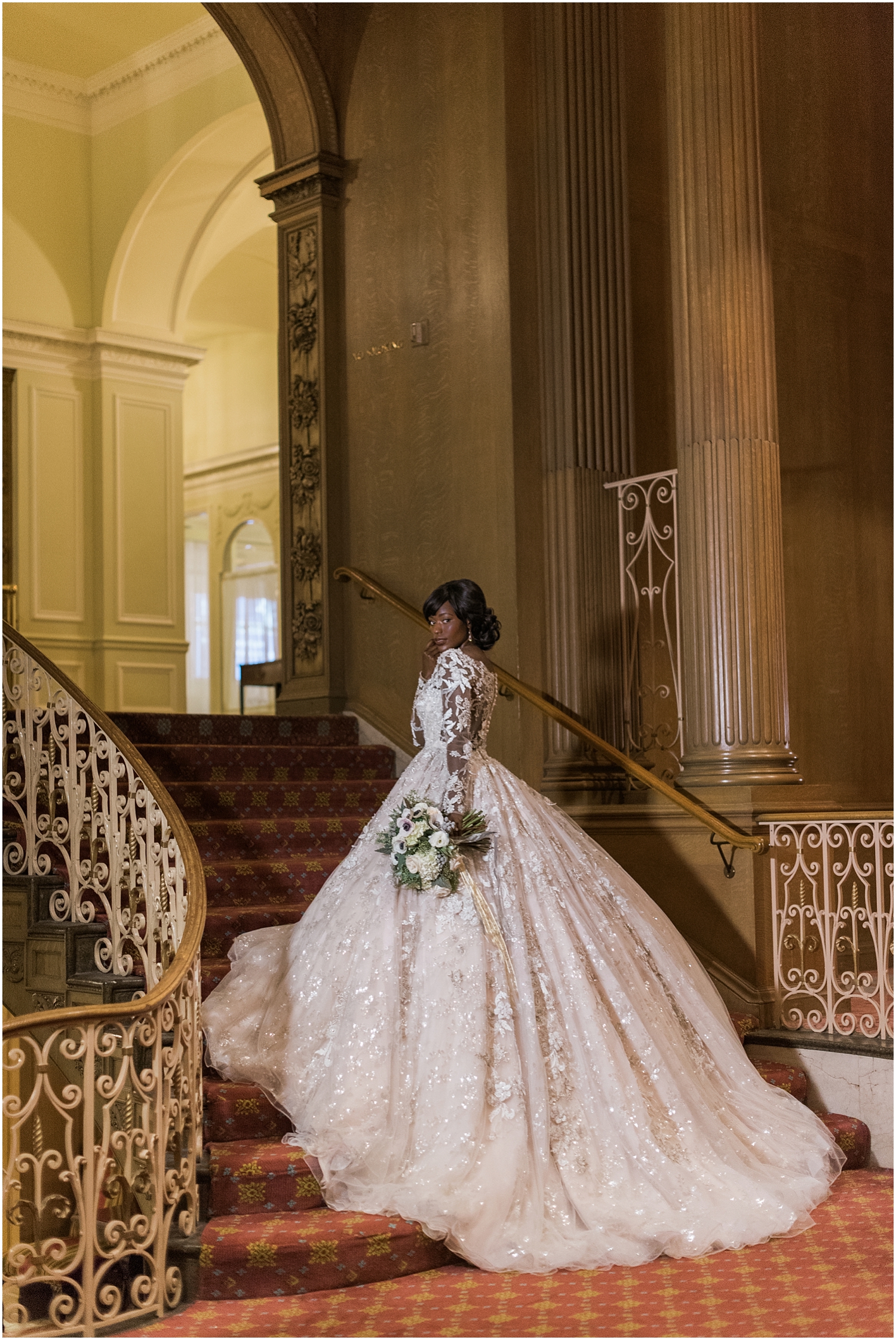 Bride on The grand staircase at the fairmont olympic hotel