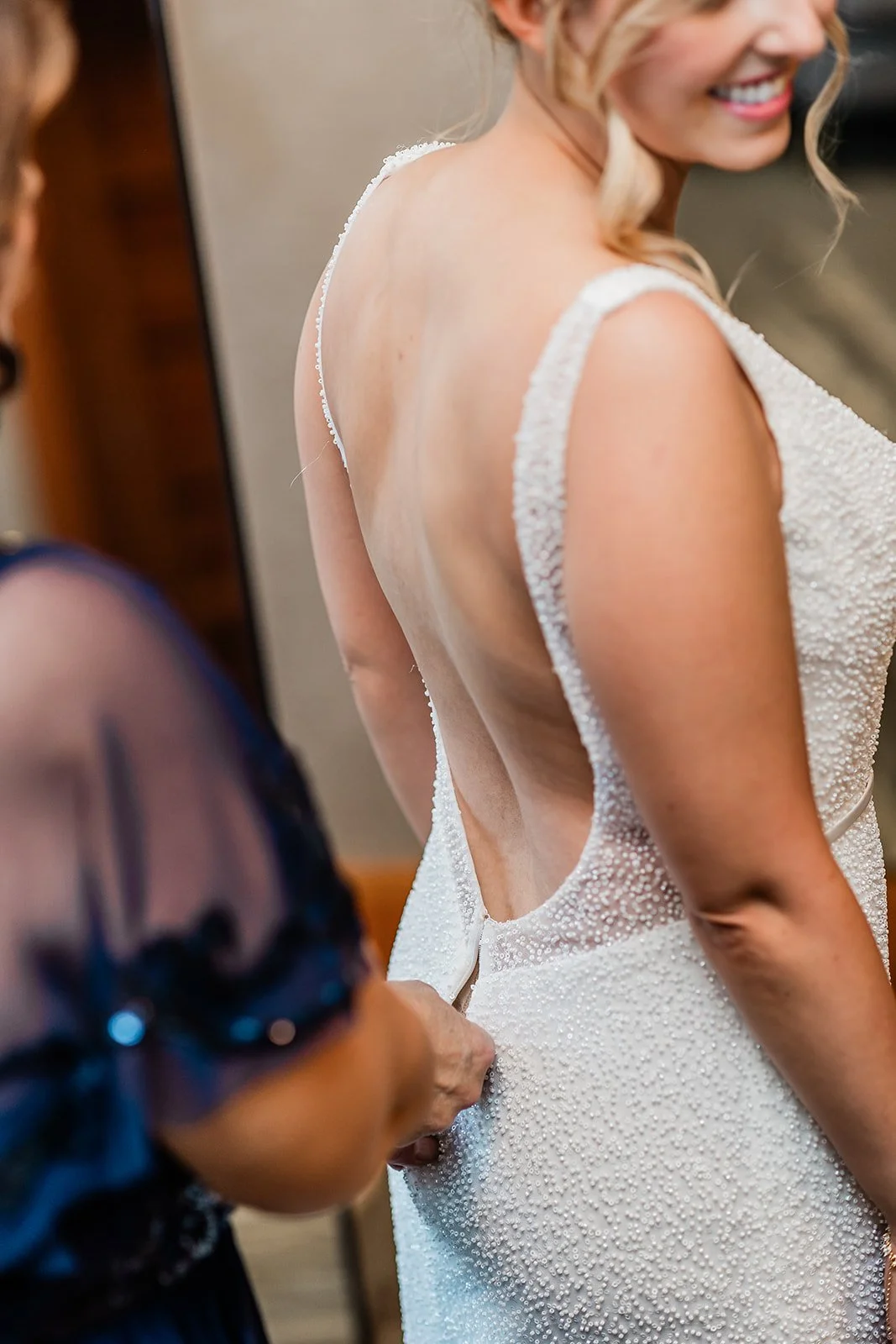 stephanie-jordan-willows-lodge-bride-getting-dressed.jpg
