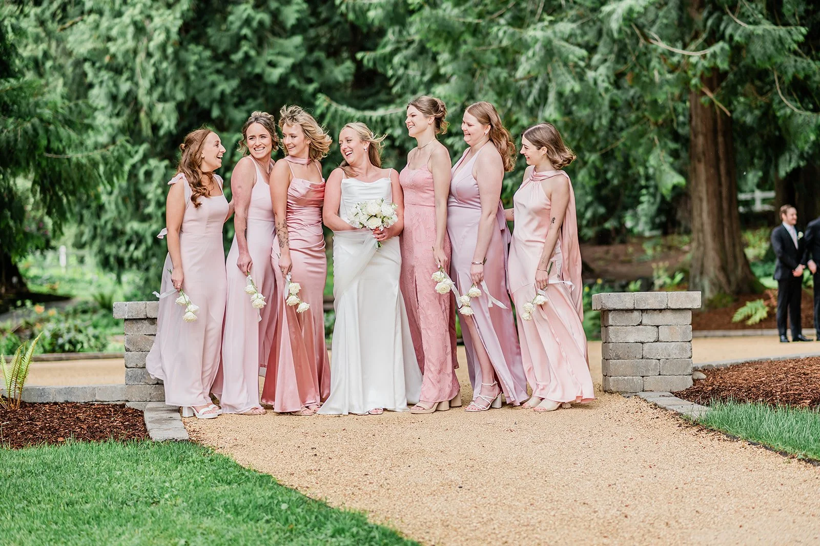 Bride with bridesmaids in pink and mauve dresses at Chateau Lill