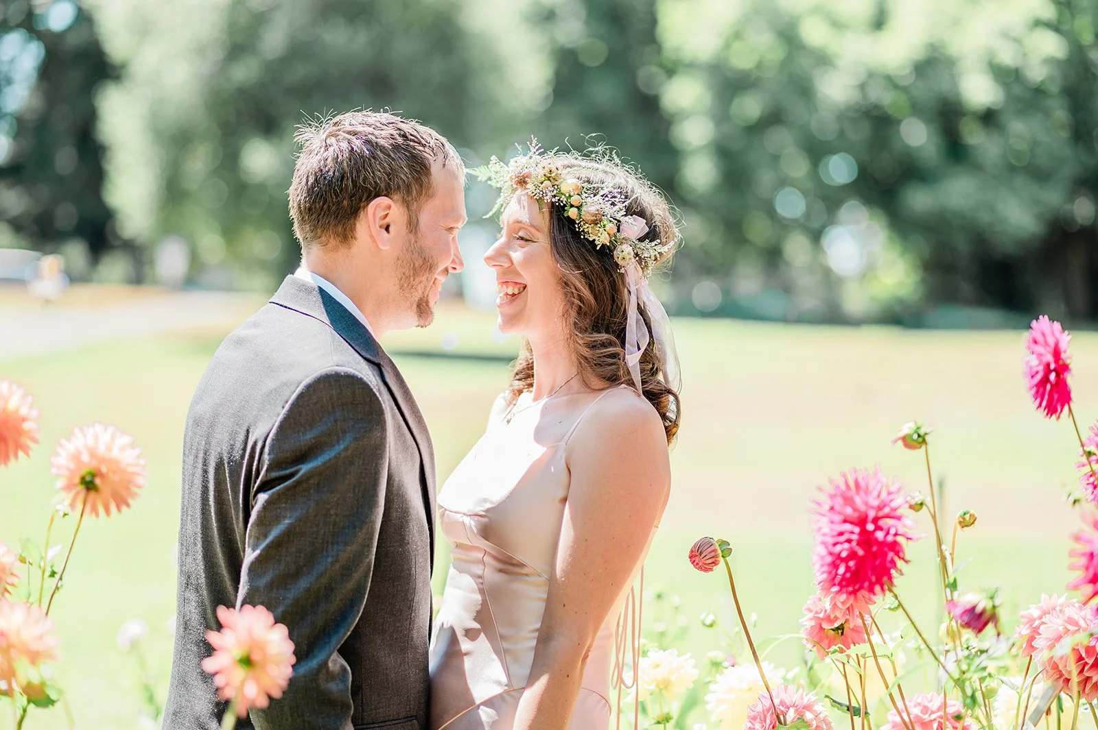 Bride and groom laughing together at the Volunteer Park Dahlia Garden Seattle