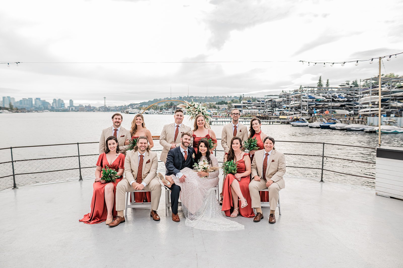 Wedding party on the MV Skansonia bow with the Seattle skyline and Space Needle
