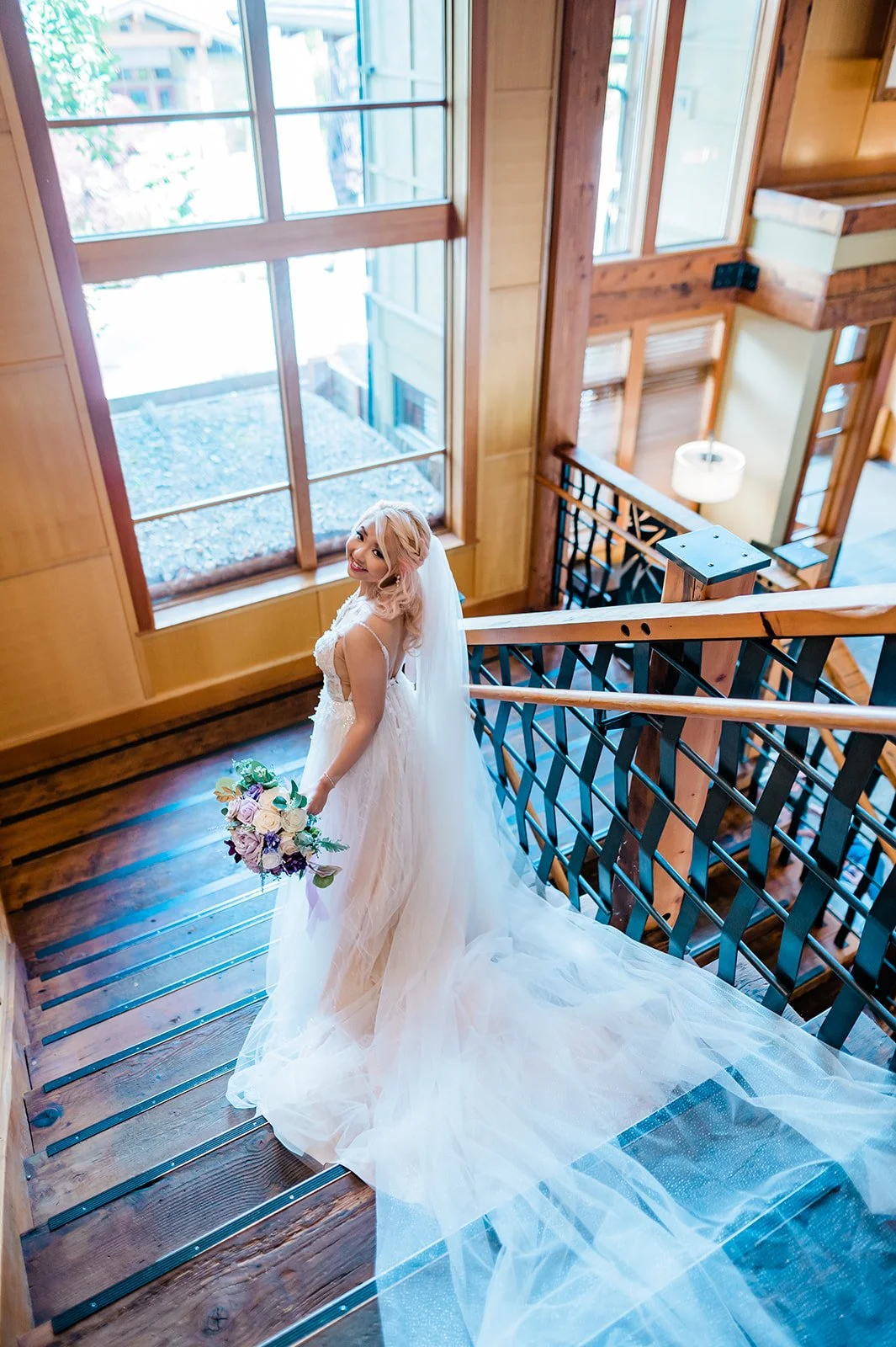 Bridal portrait on the lobby staircase at Willows Lodge, Woodinville WA