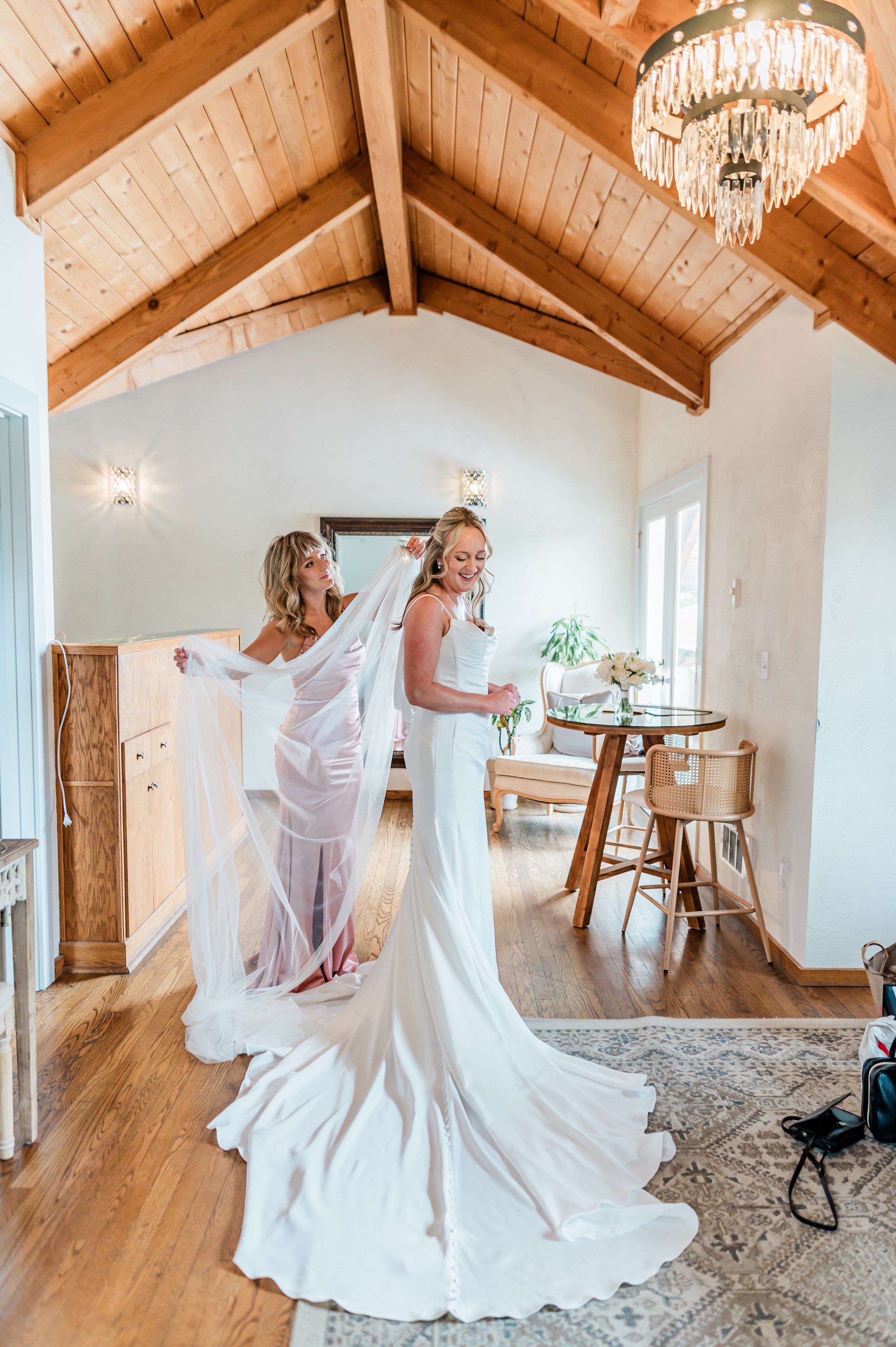 Bride getting ready in the bridal suite at Chateau Lill in Woodinville WA, with natural light and the spiral staircase visible