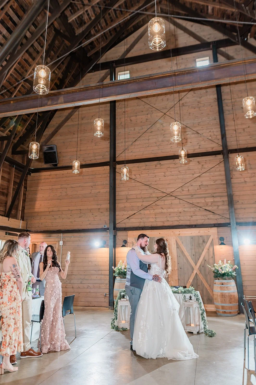 Meghan and Beau sharing their first dance in the Marionfield Farm barn