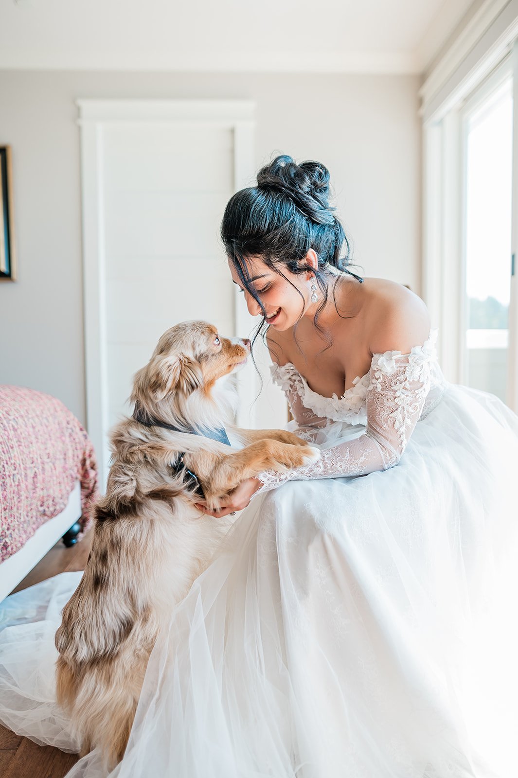 Bride laughing with her dog during wedding morning getting-ready photos in Woodinville