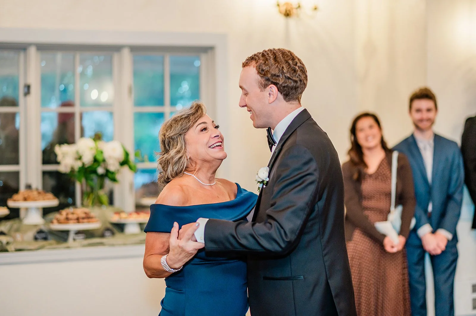 Groom dancing with his mother in the Grand Room at Chateau Lill