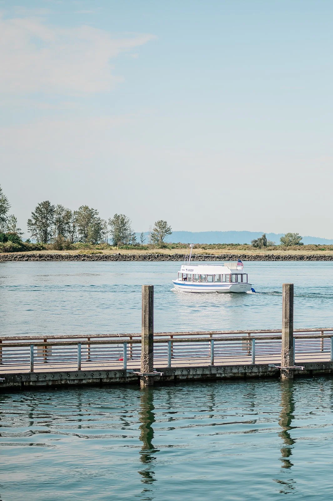 Jetty Island ferry crossing the water on a sunny summer day in Everett Washington