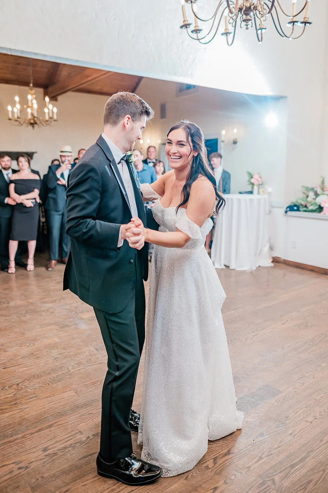 bride and groom dance in grand room at chateau lill