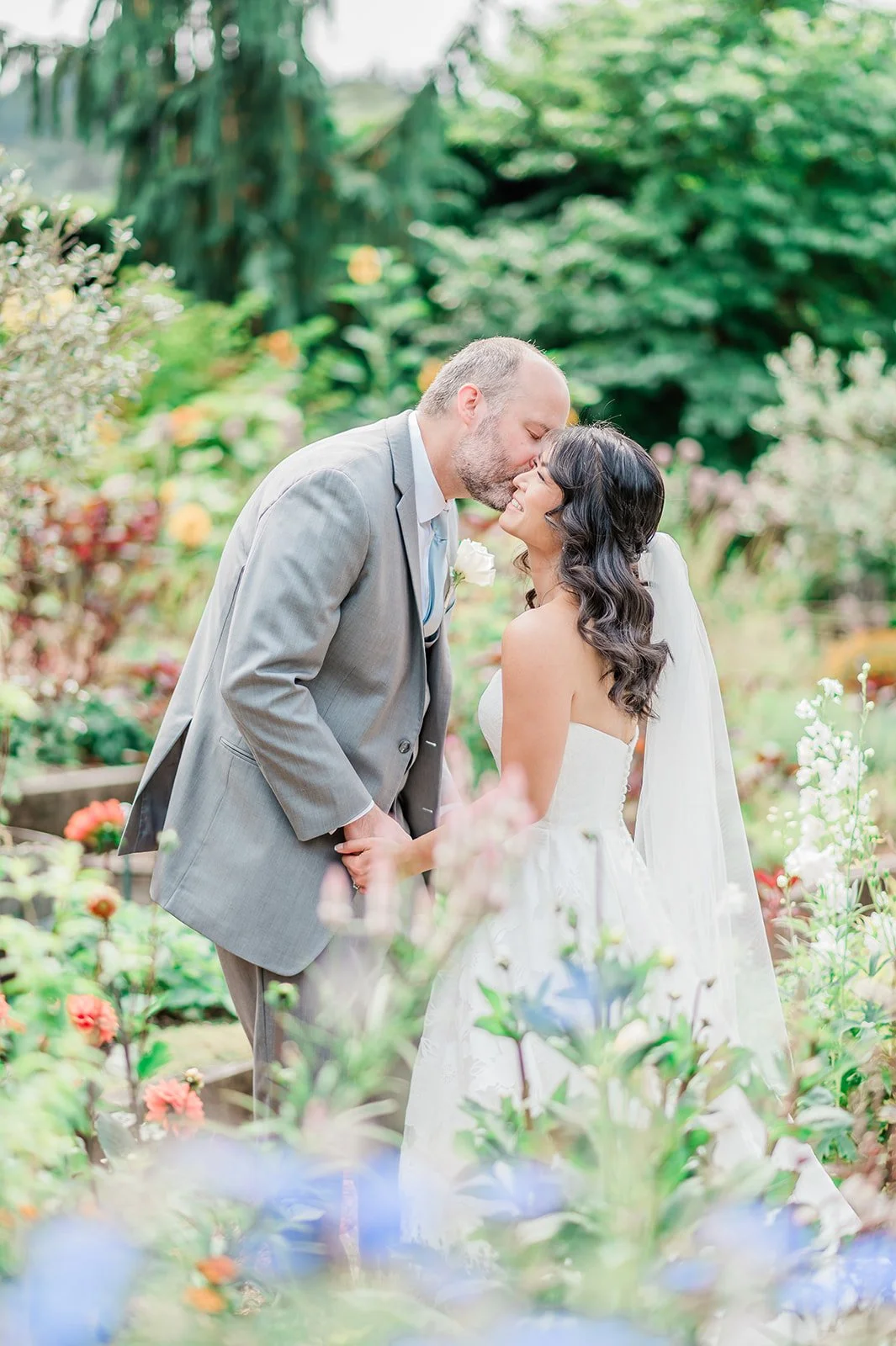 Couple embracing in the garden at Willows Lodge, Woodinville WA