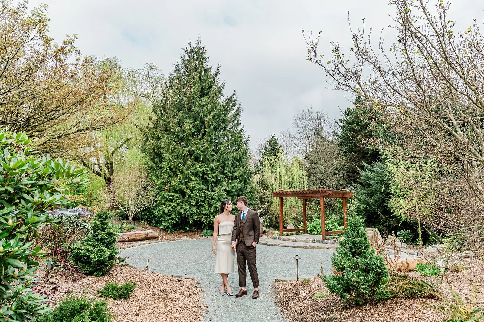 Couple walking at the Riverside Terrace, a hidden ceremony space at Willows Lodge, Woodinville WA