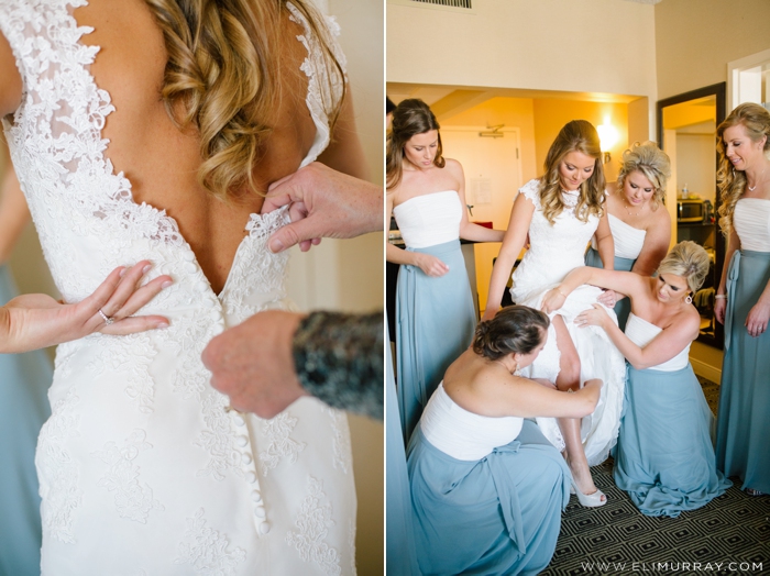 Bridesmaids helping bride get ready