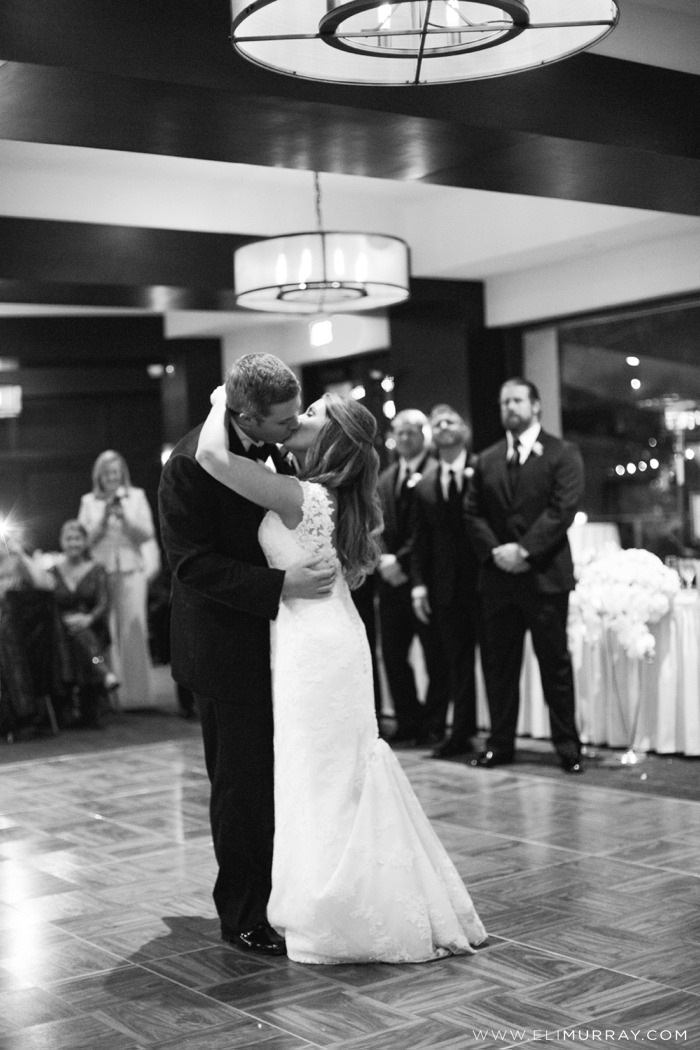 bride and groom kissing during first dance