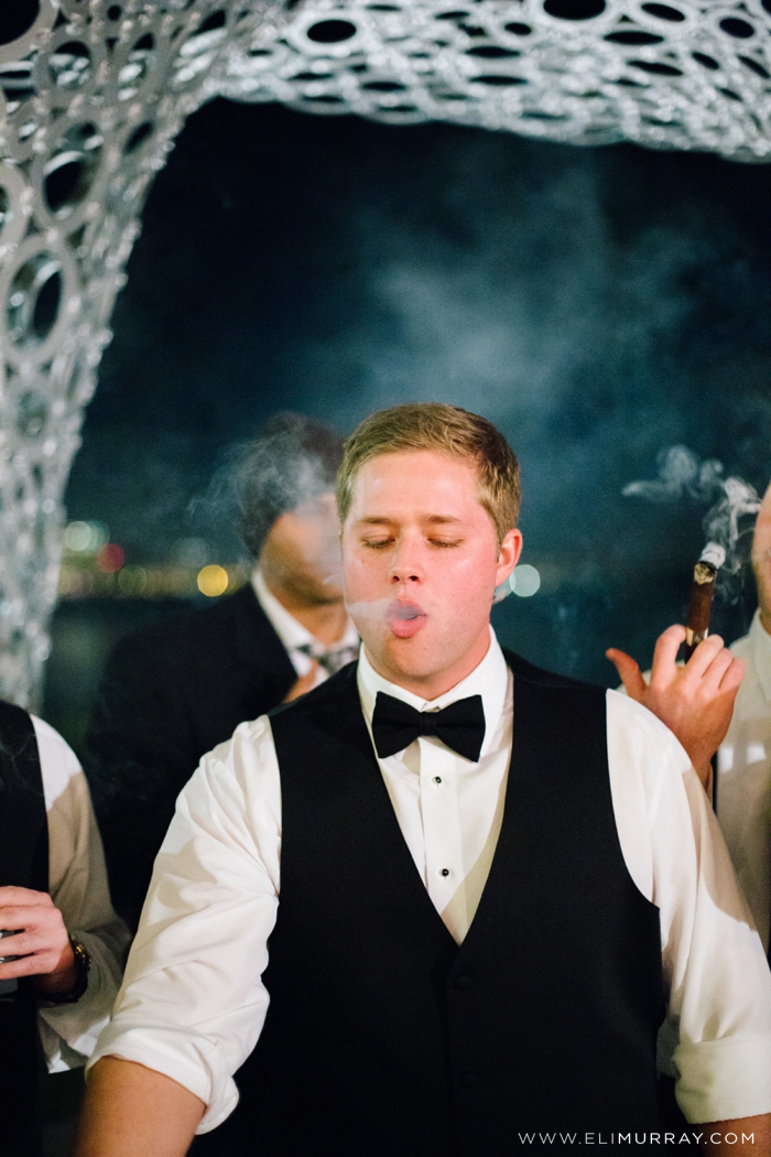 groom smoking a cigar