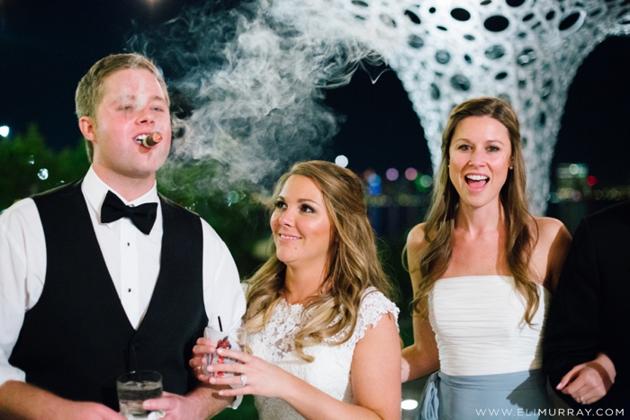 wedding party smoking cigars at reception