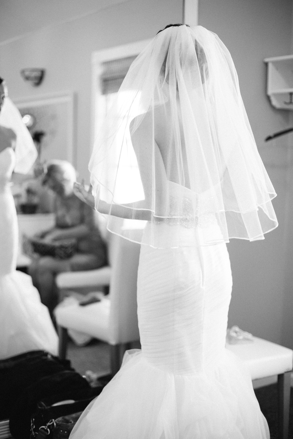 bride with veil in dressing room