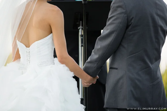 Bride and Groom holding hands