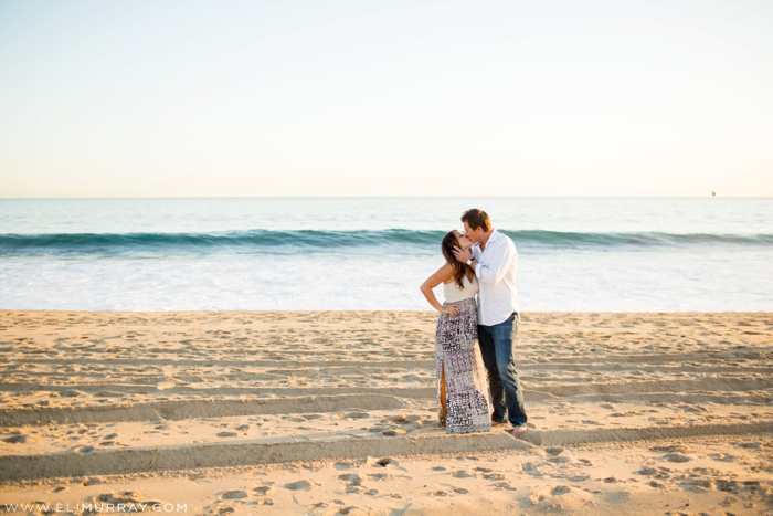 Couple kissing on the beach in California