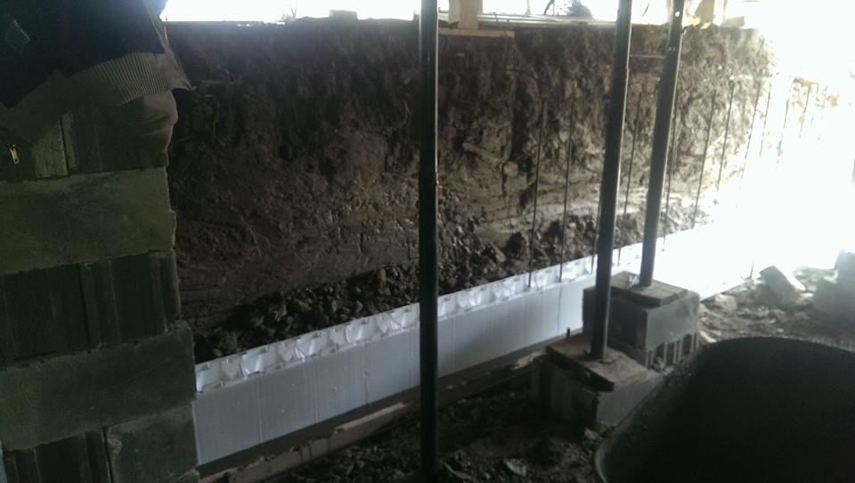Forms are being installed for new basement foundation walls.