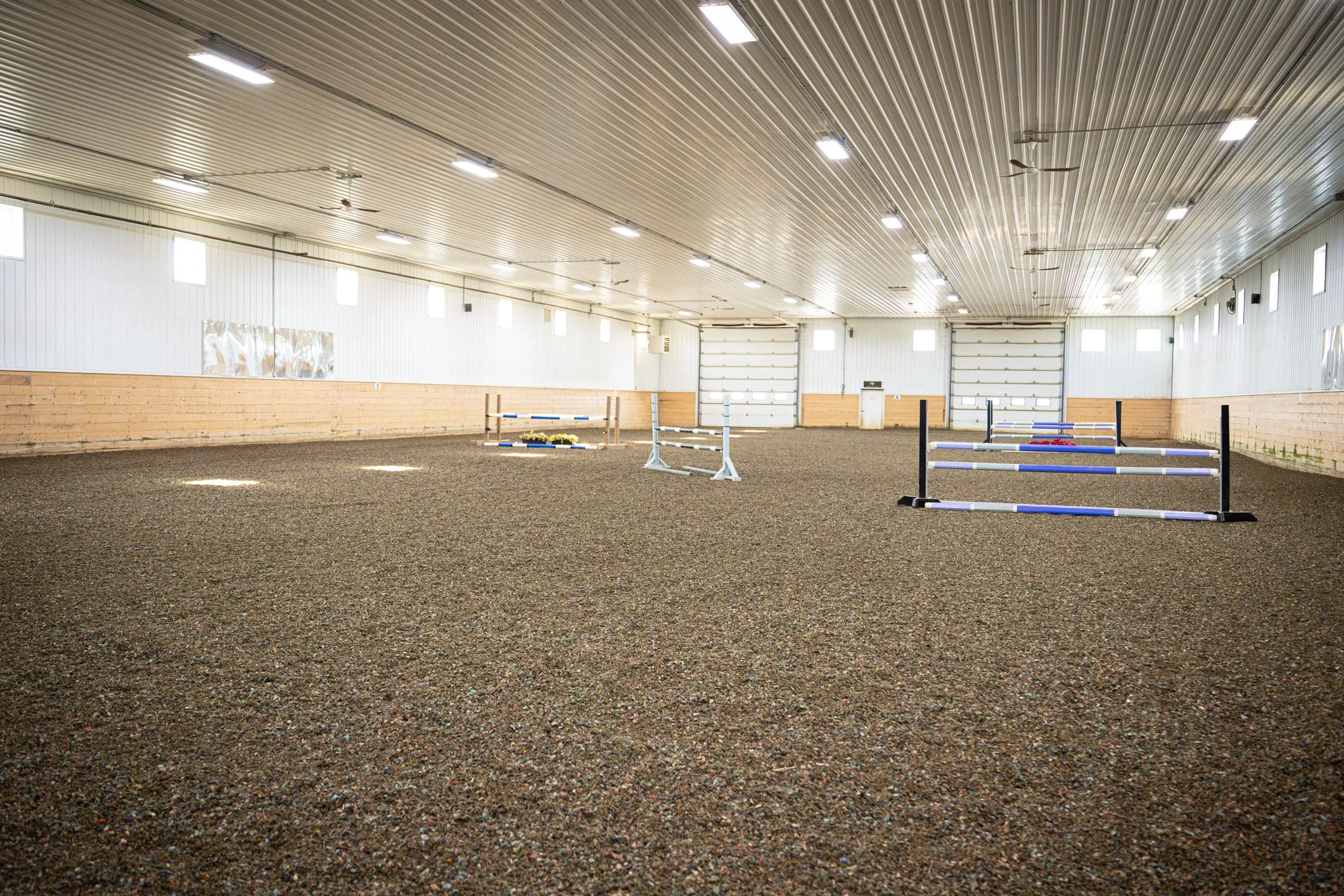 ReitenRight rubber arena footing blended into indoor riding arena sand for show jumping