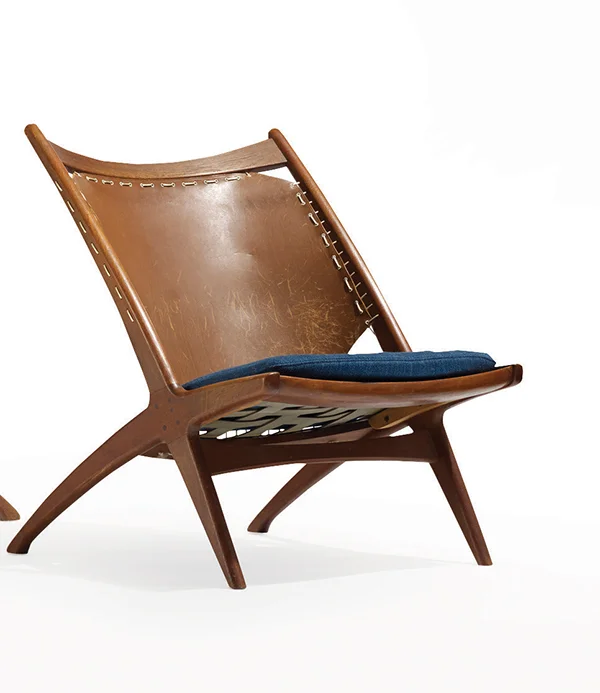 Kryss (Cross) lounge chair designed by Fredrik A. Kayser and made by Gustav Bahus, 1955, of teak, leather, and upholstery. Courtesy of Wright.