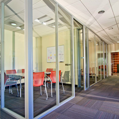 Glass partitions and doors were designed to encourage interaction and informal meetings.