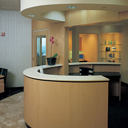 Custom designed Reception desk in Maple and granite.