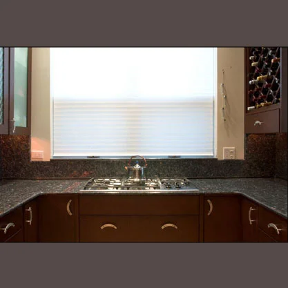 Detail of existing granite countertop reused.