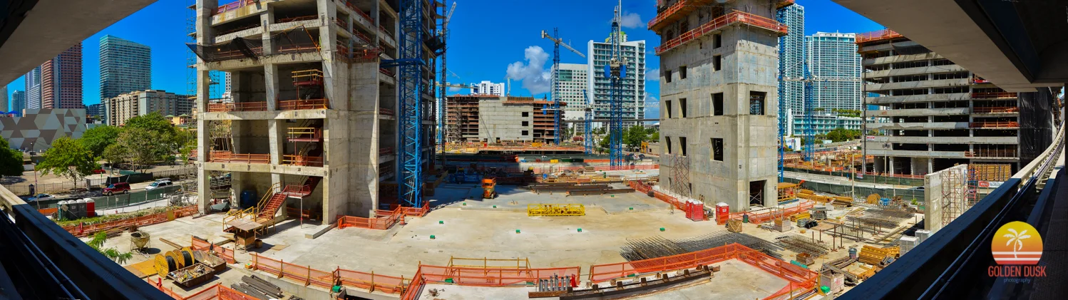 April 2014 - The underground parking has completed its rise and concrete has been poured to make way for the construction of the steel beams. Tobacco Road can no longer be seen. The Wellness Center, Condo North and Condo West have started to rise and their parking garages have been completed.