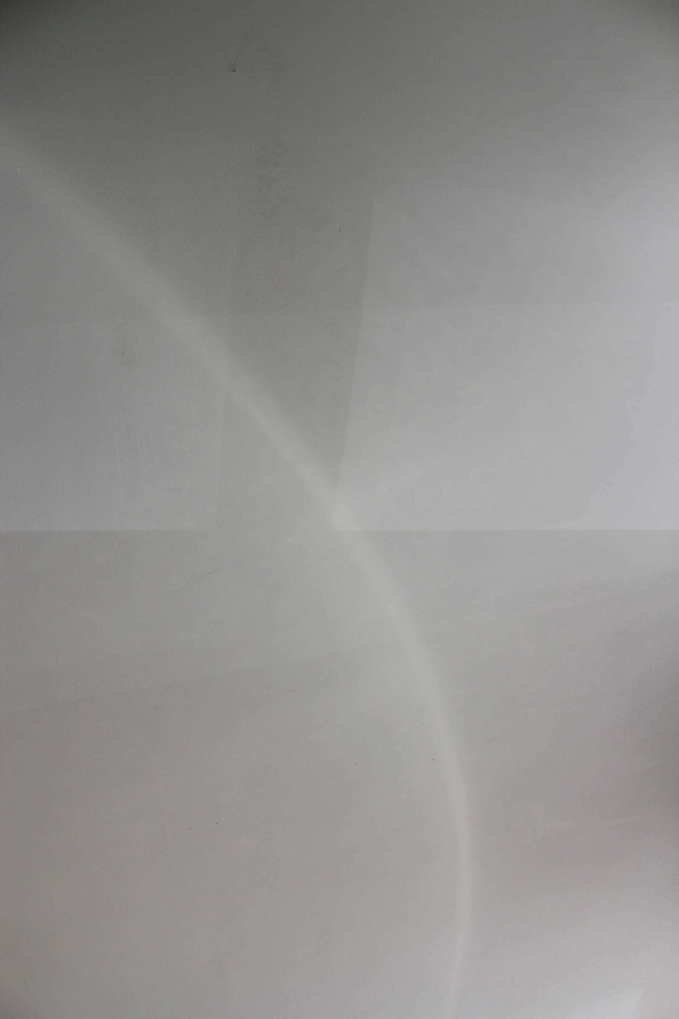 This series is a study of light. The photographs are of the reflections and spaces between two surfaces creating these forms that appear to be physical objects within the photographs, but actually exist only as light. 13" x 17" Archival Prints