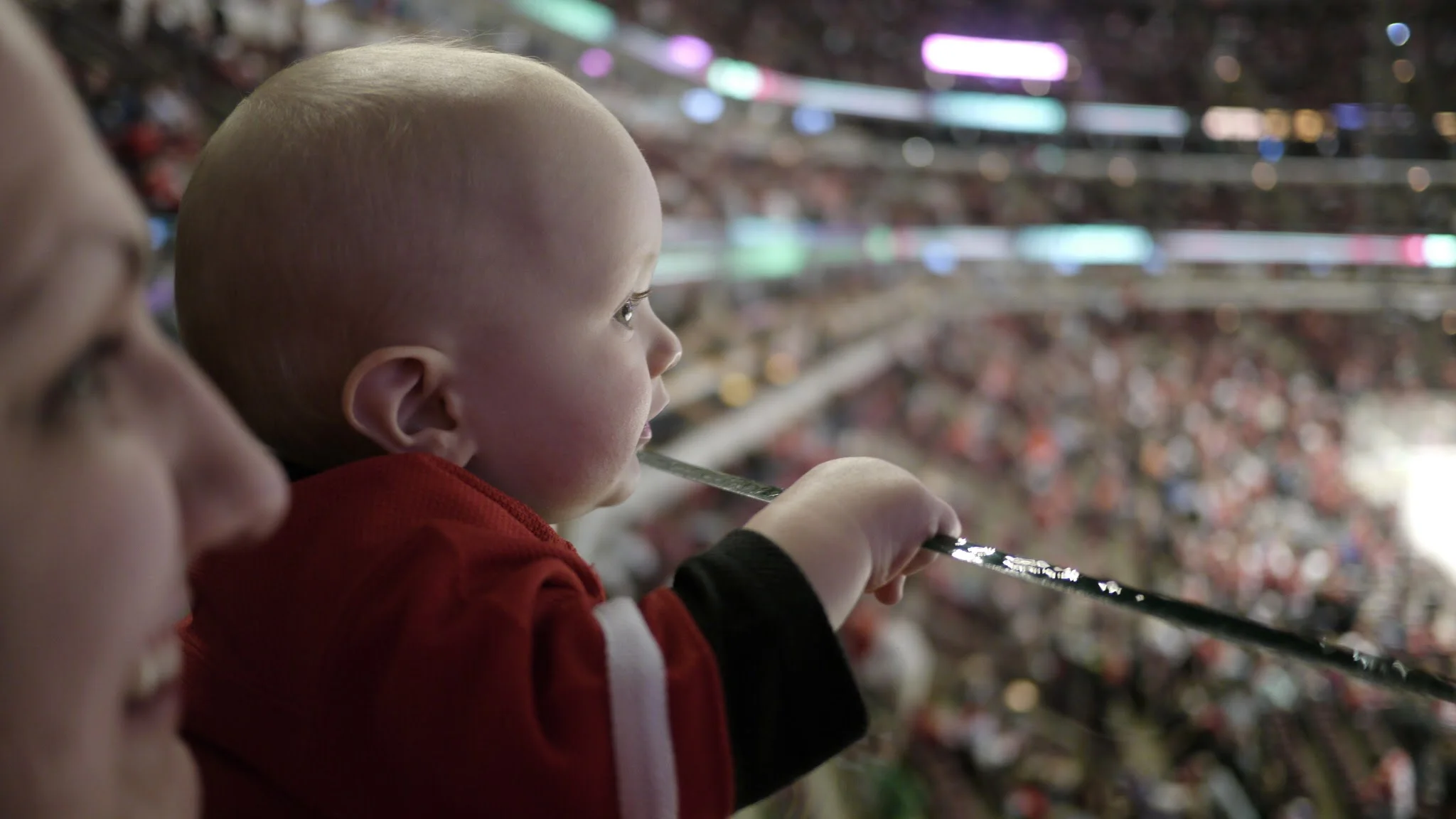 My son at his first game. (You pay for a seat to use as little of it as possible) 