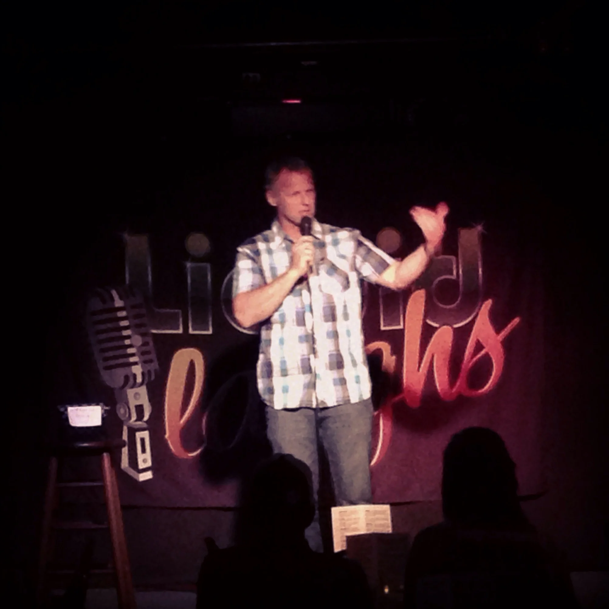 Doug on stage at Liquid Laughs