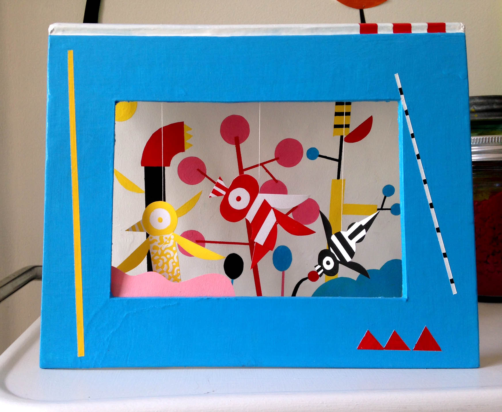 recycled book, acrylic paint, paper, string