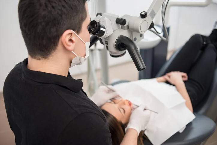 Dentist with microscope.jpg