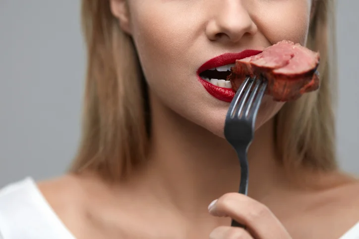 Person Eating Steak.jpg