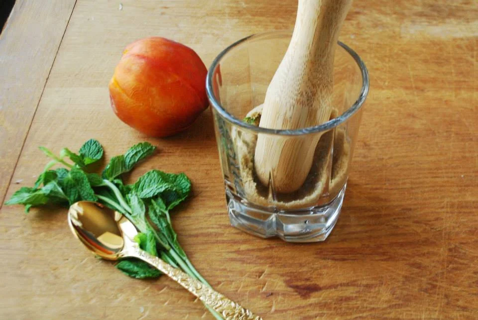 Then slice and add 2/3 of a fresh peach. Muddle that as well, stop when the level of the juice is above the fruit, and don't worry about over muddling the fruit, the more juice you have the tastier your drink will be!