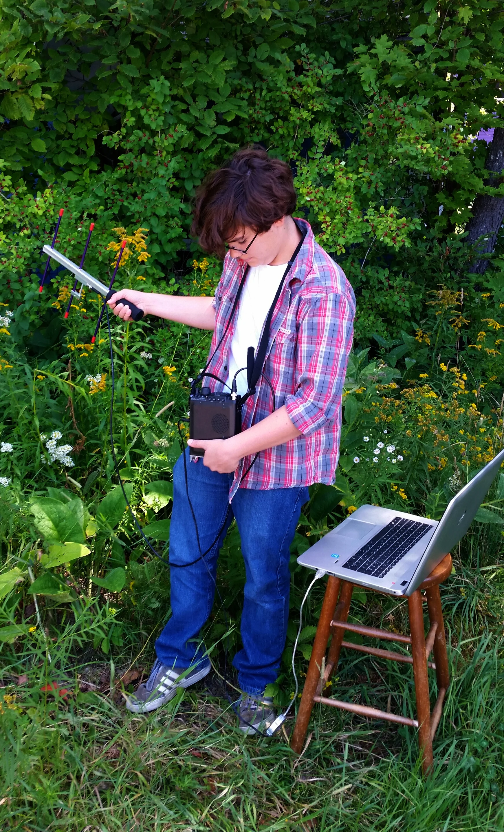 All the components of the radio recovery rig including a Yagi antenna, a radio, and a laptop.