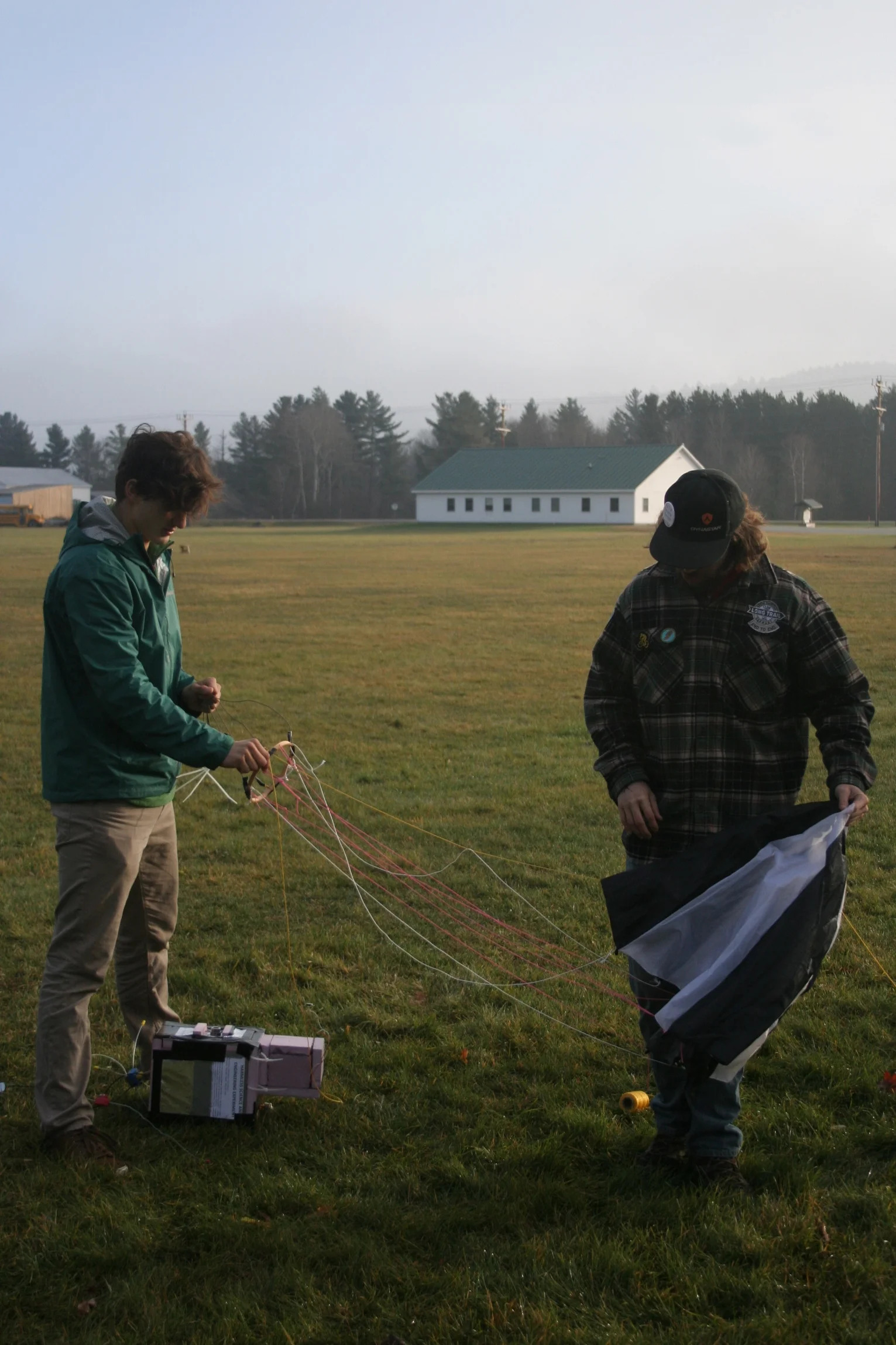 Sorting out our parachute, formerly a large umbrella!