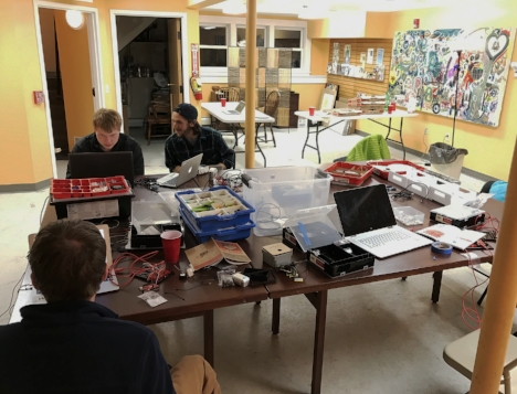 The pizza station (back right) was quickly deserted for tables covered in demos and maker materials.