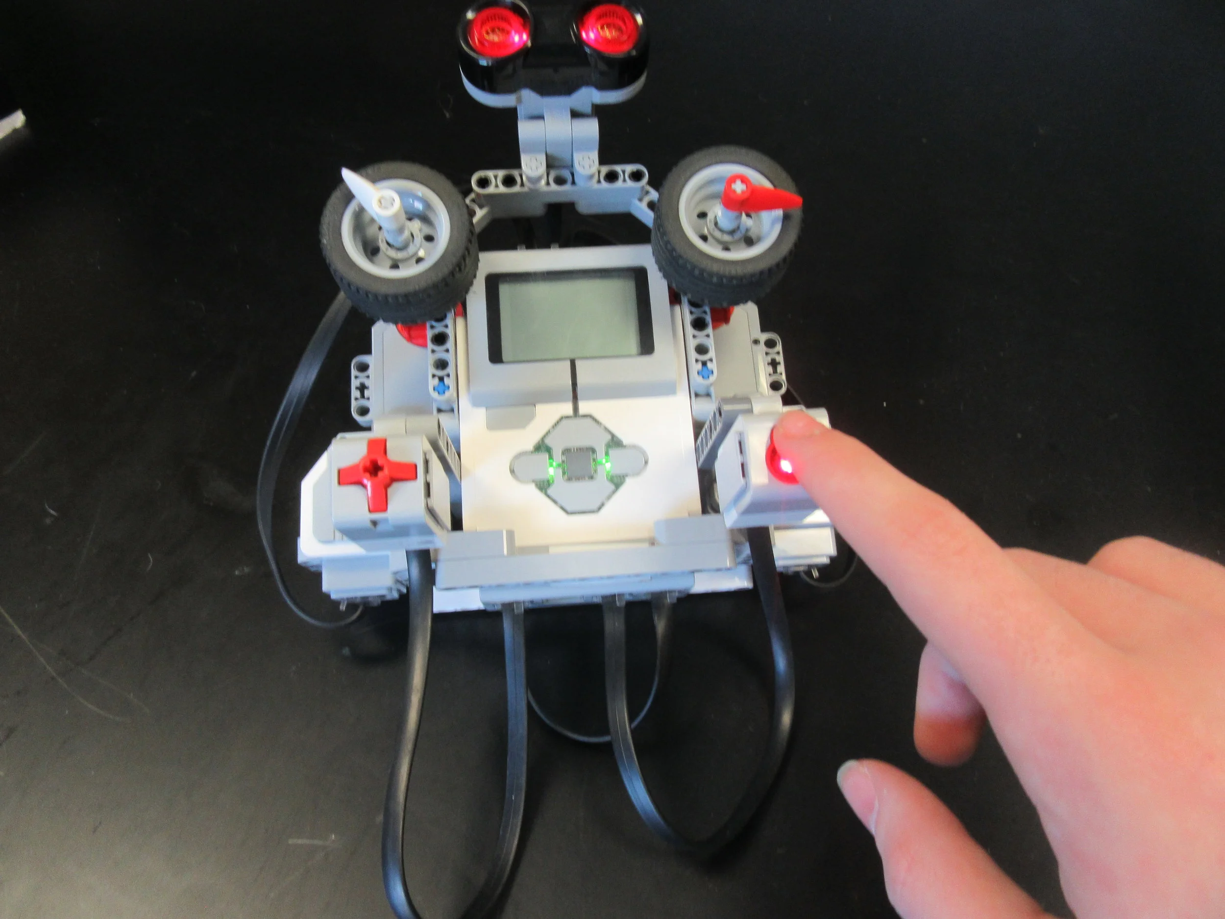  When the color sensor is covered and it detects darkness, the lights turn green and it’s ready to go 