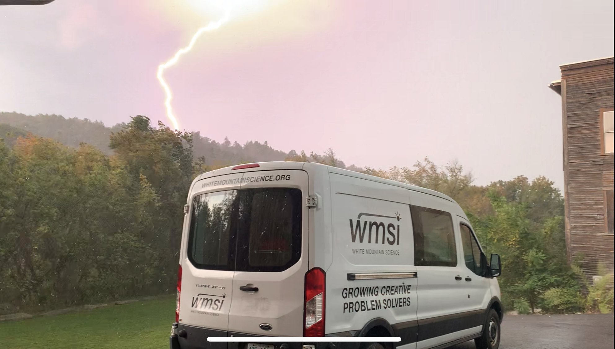  WMSI Van in front of a lightning bolt 