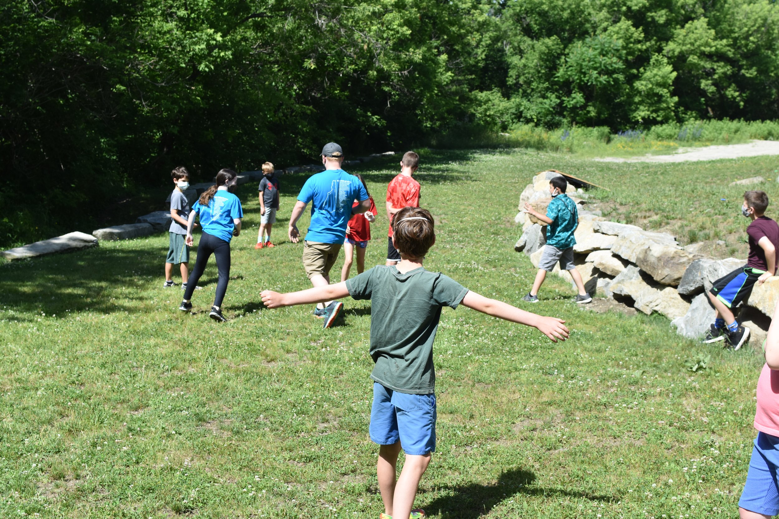  WMSI Students and Blue Shirts play outside 