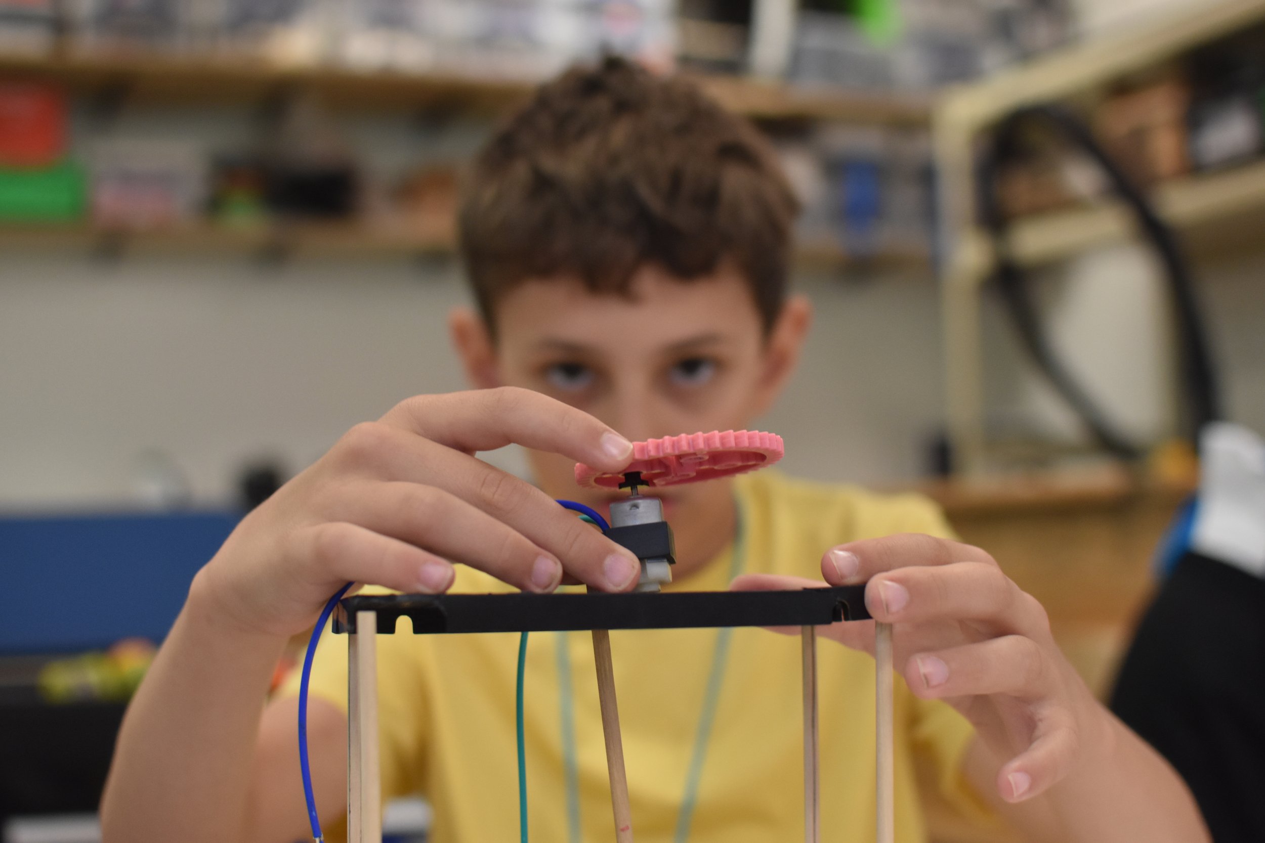  WMSI Student in the background looks over his wigglebot in the foreground 