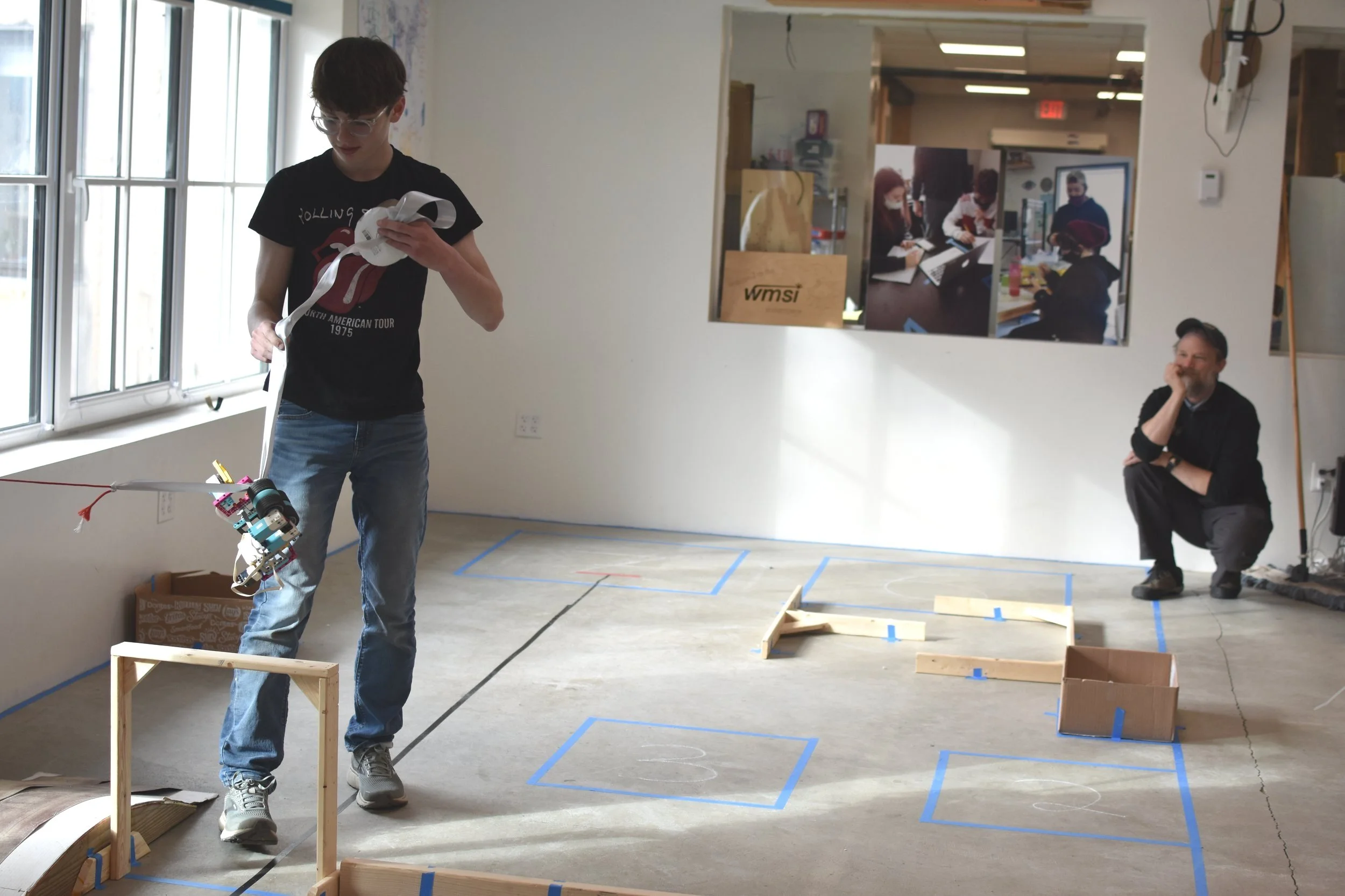  Solution diversity was one highlights of the day, including this team that created a robot that could travel along a slackline above the course.  