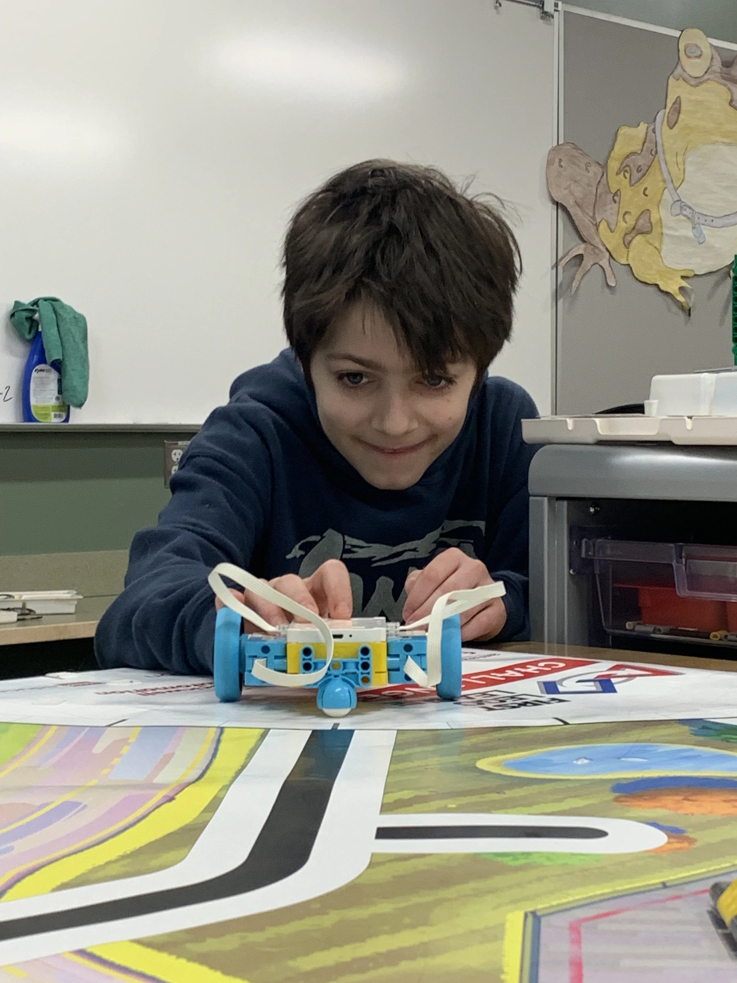  A student participates in  FIRST®  LEGO ®  League Challenge, a program for students in grades 4-8. 