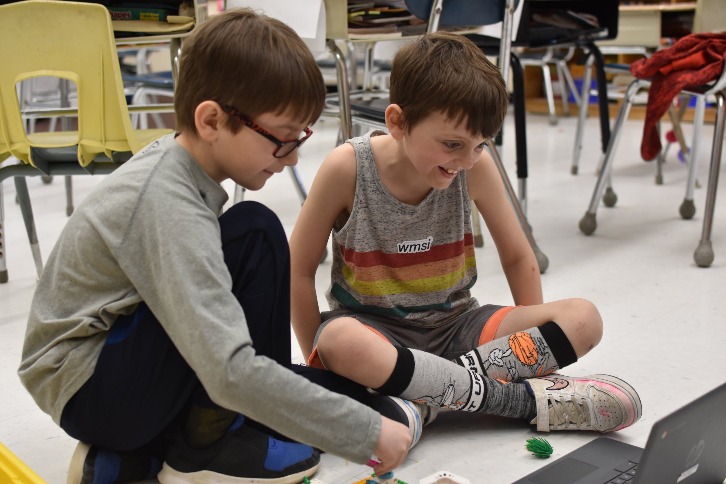  At the height of problem solving and play as these students code their helicopter to spin 